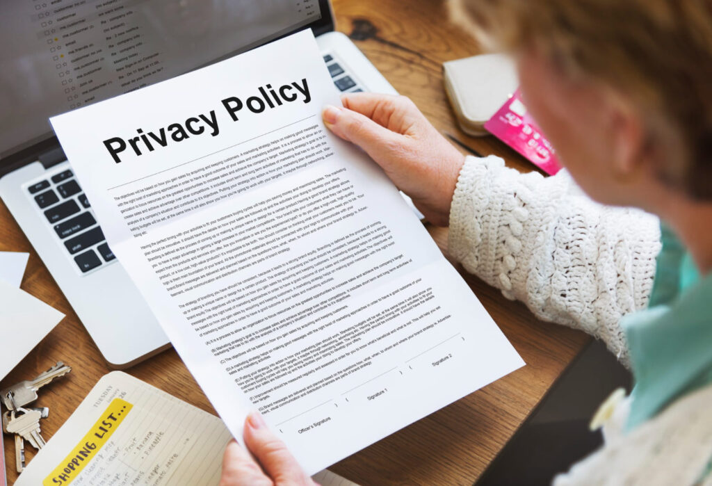 Person reviewing privacy policy document related to financial and tax services in Hollywood, FL
