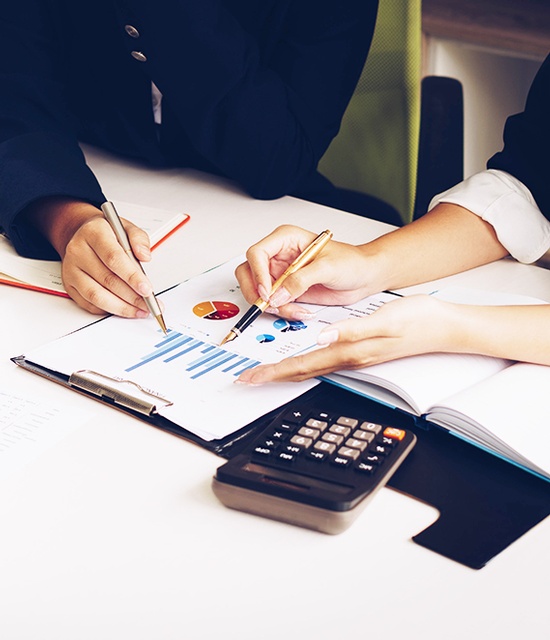 Tax consultant reviewing financial documents and calculations for accounting and bookkeeping services in Hollywood, FL